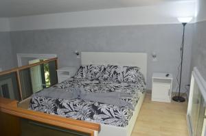 Łóżko lub łóżka w pokoju w obiekcie Petros Room Camere