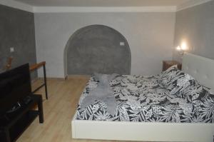 Łóżko lub łóżka w pokoju w obiekcie Petros Room Camere