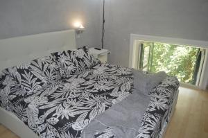 Łóżko lub łóżka w pokoju w obiekcie Petros Room Camere