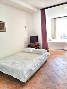 Posteľ alebo postele v izbe v ubytovaní Villa Panorama Seget