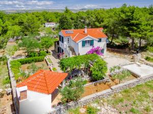 an aerial view of a house with an orange roof at Apartment Rusula in Milna