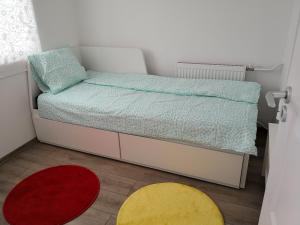 Postel nebo postele na pokoji v ubytování Green Garden Plus Apartman