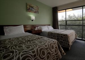 Postel nebo postele na pokoji v ubytování Hotel El Greco