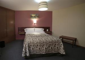 Postel nebo postele na pokoji v ubytování Hotel El Greco