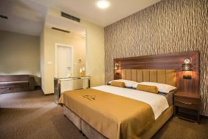 a bedroom with a large bed in a room at Central Luxury Rooms in Omiš