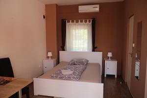 Postel nebo postele na pokoji v ubytování Hortobágyi Kemencés Vendégház