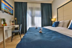 Postel nebo postele na pokoji v ubytování Hotel Harmony by Aycon