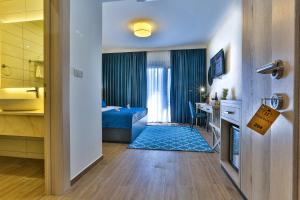 Postel nebo postele na pokoji v ubytování Hotel Harmony by Aycon