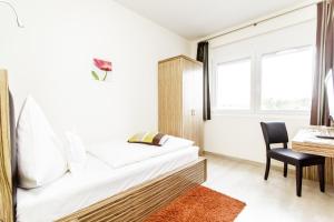Postel nebo postele na pokoji v ubytování Hotel Maxis - digitaler Self-check-in -
