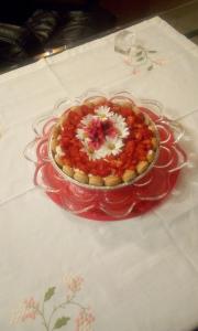 a glass plate with a dessert on a table at La casa di Mariù in Furnari