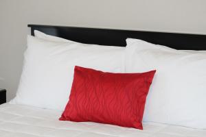 Ένα ή περισσότερα κρεβάτια σε δωμάτιο στο Coromandel Cottages
