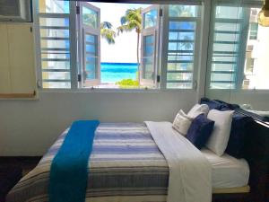 Voodi või voodid majutusasutuse Coco Mar Oceanview Studios toas