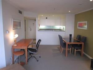 an office with a desk and chairs and a table at Quay West 2007- Self Catering in Sydney