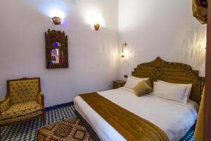 Postel nebo postele na pokoji v ubytování Riad Dar Bab Guissa