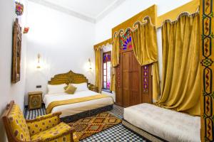 Postel nebo postele na pokoji v ubytování Riad Dar Bab Guissa