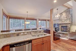 a kitchen with a sink and a fireplace at 6509 Settlers Creek Townhomes in Keystone