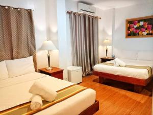 Postel nebo postele na pokoji v ubytování Discover Boracay Hotel + 35 fotografií