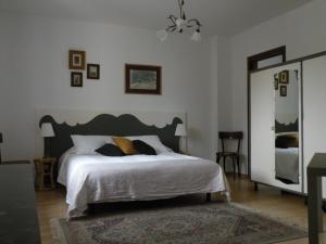 Säng eller sängar i ett rum på Tetto Nuovo B&B