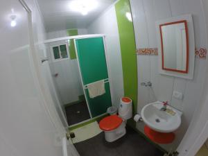 a small bathroom with a toilet and a sink at Zippy´s Sea View Apartments in San Andrés