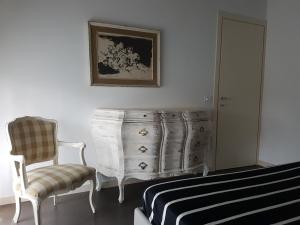 A bed or beds in a room at Casa Savoia Még 12 kép