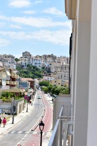 a view from a balcony of a city street at Hotel Amyclae in Sperlonga