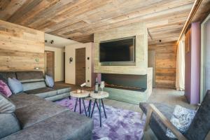 A television and/or entertainment centre at Chalet SALENA luxury lodge