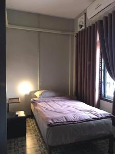 Postel nebo postele na pokoji v ubytování Chato Hostel