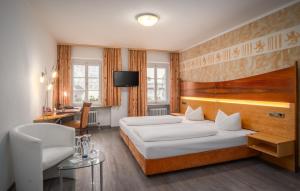 Postel nebo postele na pokoji v ubytování Hotel Passauer Wolf + 30 fotografií