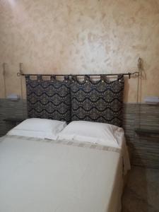 Ένα ή περισσότερα κρεβάτια σε δωμάτιο στο Casa Solemare