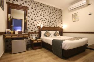 Voodi või voodid majutusasutuse Hotel Amar Inn- Lajpat Nagar Central Market toas