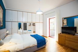 En eller flere senge i et værelse på La Vita Moderna