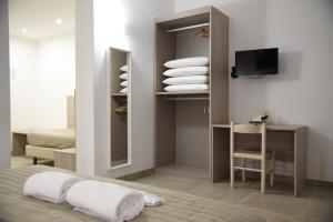 Postel nebo postele na pokoji v ubytování Hotel Belsito