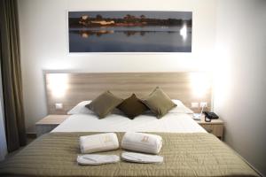 Postel nebo postele na pokoji v ubytování Hotel Belsito