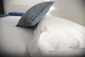 Postel nebo postele na pokoji v ubytování Hotel Belsito