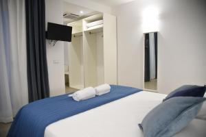 Postel nebo postele na pokoji v ubytování Hotel Belsito