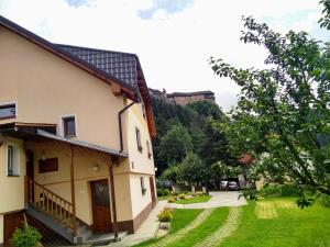 a view of a house with a yard at Apartmán 80 in Oravský Podzámok