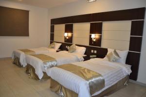 Postel nebo postele na pokoji v ubytování Jazan Heart Hotel + 25 fotografií