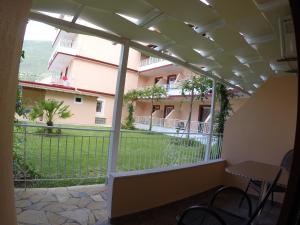 a balcony with a view of a building at Kalias Hotel in Vasiliki