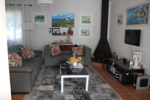 a living room with a couch and a table at Hubbs Place in Sedgefield