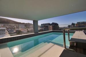 a swimming pool on the roof of a building at Sensational Sentinel in Cape Town