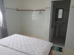Postel nebo postele na pokoji v ubytování Khách sạn Mộng An