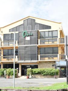 a building with a clazon sign in front of it at Brandsville Suites in Georgetown