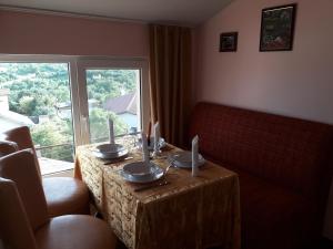 a table in a living room with a table and a window at Villa Sunny Hill in Fish Fish +25 photos