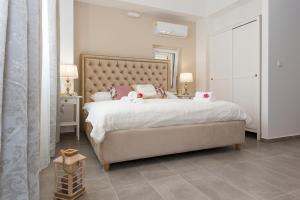 a bedroom with a large bed with two stuffed animals on it at Luxury Rooms Saint Jacob in Trogir
