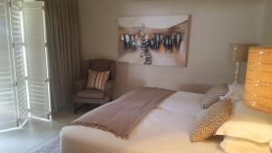 Postelja oz. postelje v sobi nastanitve Barra Beach Villa