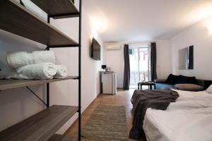 A bed or beds in a room at Cherry Garden1 Apartments