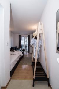 A bed or beds in a room at Cherry Garden1 Apartments