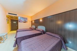 Postel nebo postele na pokoji v ubytování Hotel Monreal Jumilla