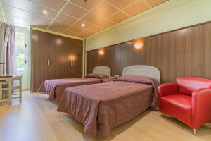 Postel nebo postele na pokoji v ubytování Hotel Monreal Jumilla