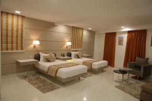 Postel nebo postele na pokoji v ubytování Residency Hotel Fort